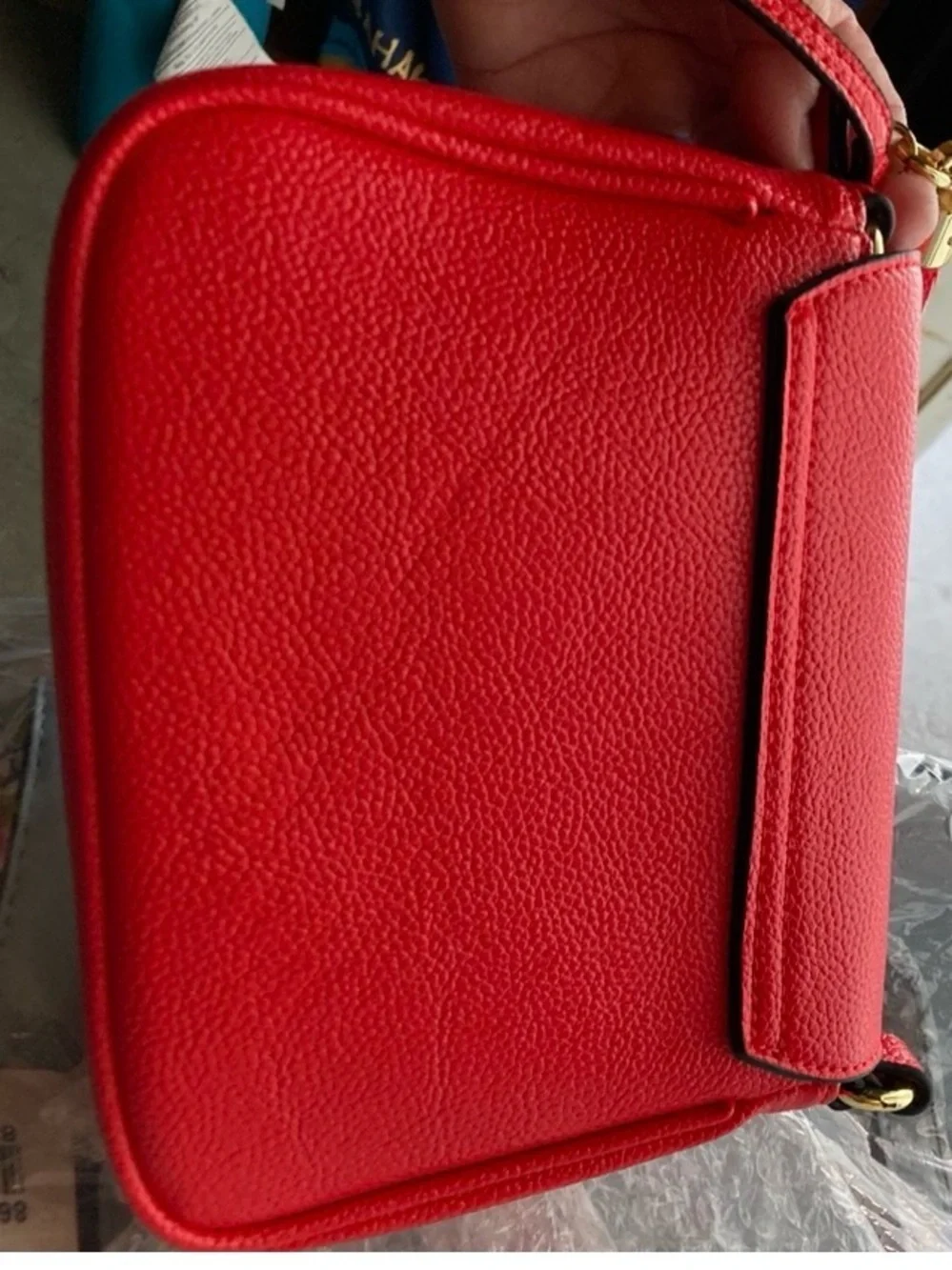 Compact Red Crossbody Bag with Tassel Accent